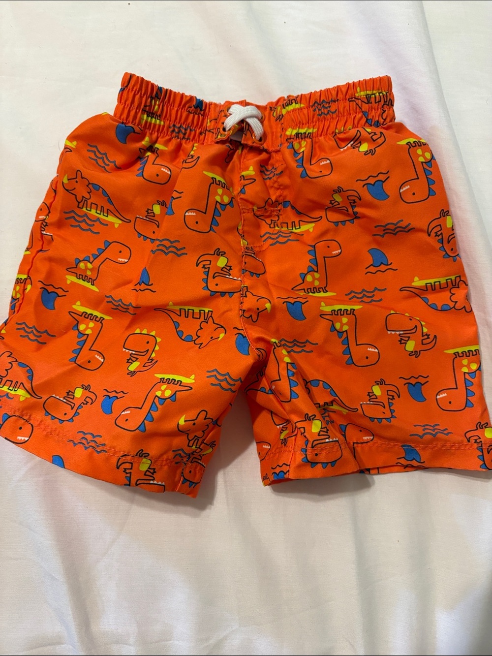 Kids' Orange Dino Print Swim Shorts